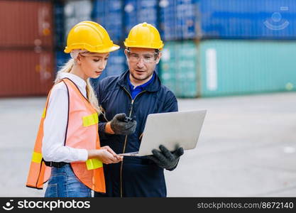 Logistic shipping worker team work working in shipping port cargo containers for export and import goods monitor with laptop computer.