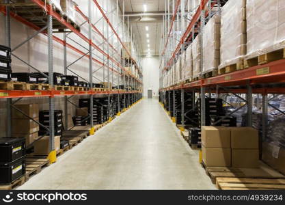 logistic, storage, shipment, industry and manufacturing concept - cargo boxes storing at warehouse shelves. cargo boxes storing at warehouse shelves