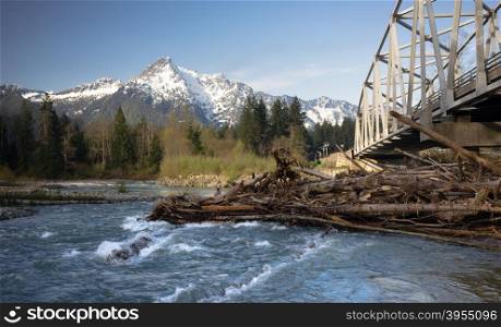 Logs jam up under the bridge on the Sauk River