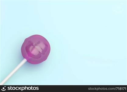 Lollipop on turquoise background, top view