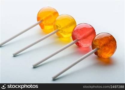 Lollipops assortment on blue pastel background