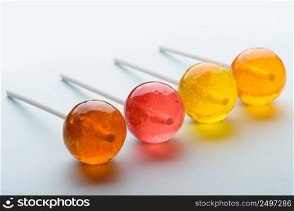 Lollipops assortment on pastel background