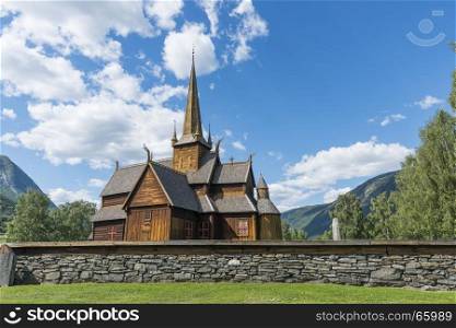 Lom stave church (Lom stavkyrkje) with graveyard foreground, Lom, Norway