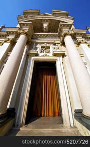 lombardy in the busto arsizio old church closed brick tower sidewalk italy