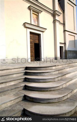lombardy in the cadrezzate old church closed brick tower sidewalk italy