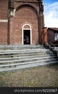 lombardy in the cardano al campo old church closed brick tower sidewalk italy
