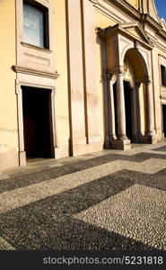 lombardy in the castano primo old church closed brick tower sidewalk italy