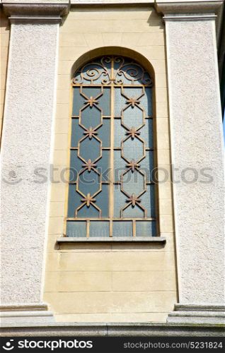 lonate pozzolo cross church varese italy the old rose window and mosaic wall in the sky sunny day