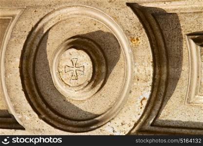 lonate pozzolo lombardy italy varese abstract wall of a curch circle pattern cross