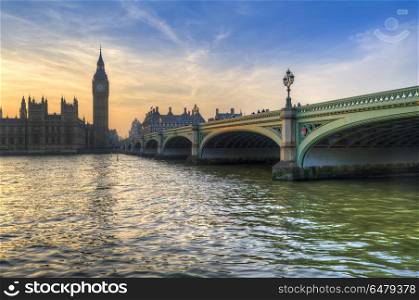 London attractions Big Ben and Westminster Bridge landscape duri. England, London, Westminster. Big Ben and Westminster Bridge during a Winter sunset.. Big Ben and Westminster Bridge landscape during a Winter sunset
