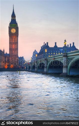 London attractions Big Ben and Westminster Bridge landscape duri. England, London, Westminster. Big Ben and Westminster Bridge during a Winter sunset.. Big Ben and Westminster Bridge landscape during a Winter sunset