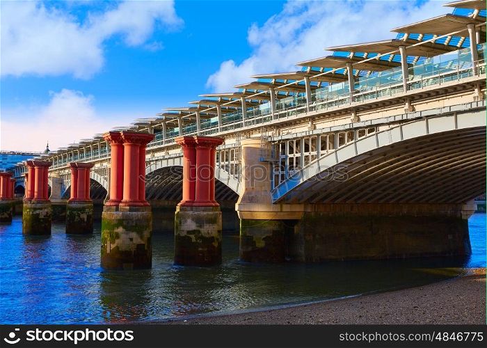 London Blackfriars Train bridge in Thames river UK
