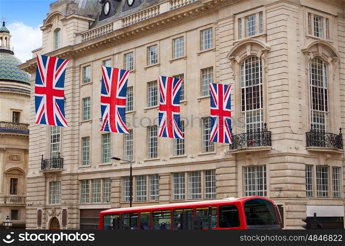 London Bus and UK flags in Piccadilly Circus England