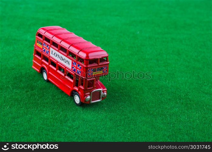 London bus. Red london bus on green grass