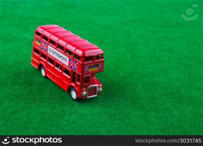 London bus. Red london bus on green grass