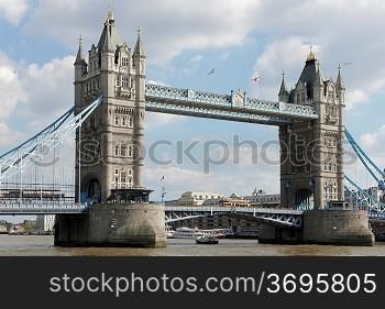 London circa 2009.Tower Bridge with a London tour bus viewed from The Thames river