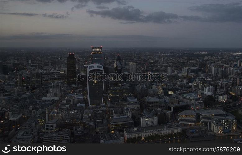 London city aerial view over skyline with dramatic sky
