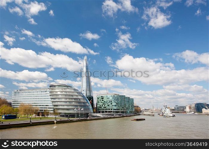 London City Hall Skylines along River Thames against blue sky, England UK