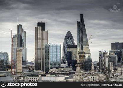 London cityscape skyline with iconic landmark buildings in The C. Places. London cityscape skyline with iconic landmark buildings in The City with dramatic stormy sky
