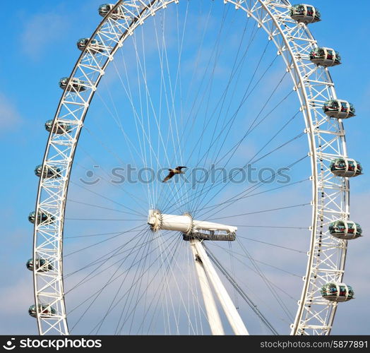 london eye in the spring sky and white clouds