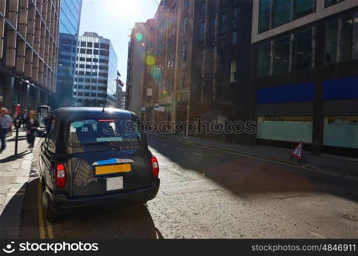 London financial district street Square Mile England UK and taxi cab