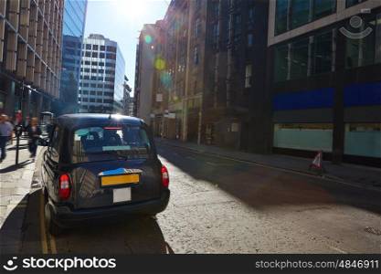 London financial district street Square Mile England UK and taxi cab