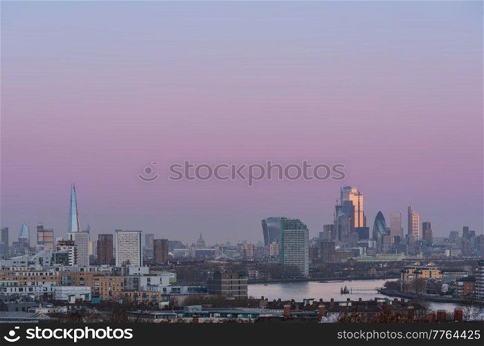 LONDON, JANUARY 30, 2022 - Stunning sunrise view of City Square Mile in London at sunrise with beautful soft light and all landmark building visible