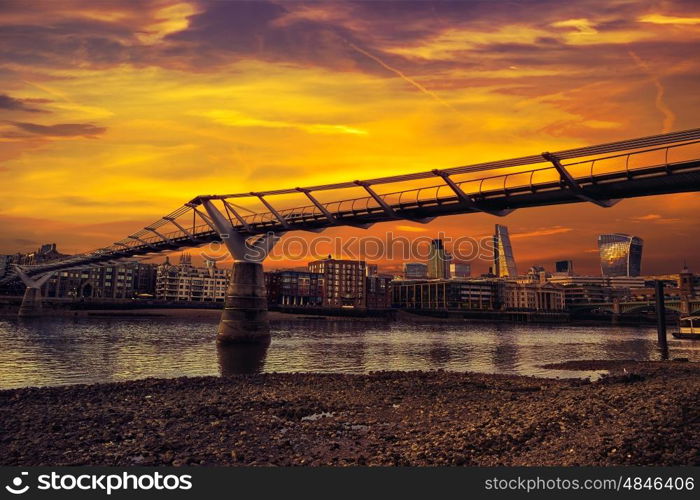 London Millennium bridge sunset skyline in UK at dusk