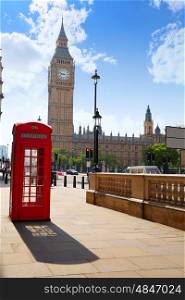 London old red Telephone box and Big Ben clock tower in England