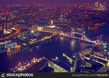London rooftop view panorama at sunset with urban architectures and The Tower Bridge with Thames River at night