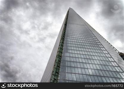 LONDON - SEPTEMBER 24, 2016: Upward view of Shard Building. It i. LONDON - SEPTEMBER 24, 2016: Upward view of Shard Building. It is the tallest skyscraper in UK.