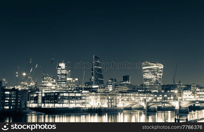 London skyline and Thames at night.. London skyline and Thames at night