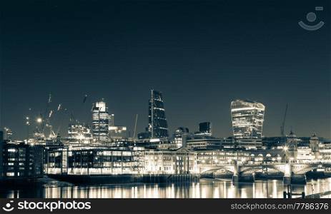 London skyline and Thames at night.. London skyline and Thames at night