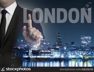 London skyline at night with businessman concept . London skyline at night with businessman concept.