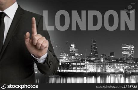 London skyline at night with businessman concept . London skyline at night with businessman concept.