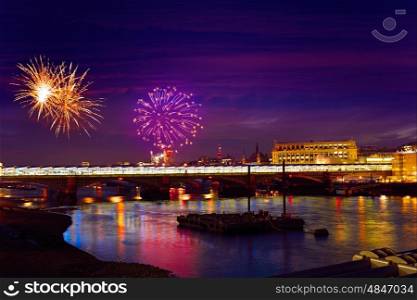 London skyline sunset fireworks on Thames river reflection at UK