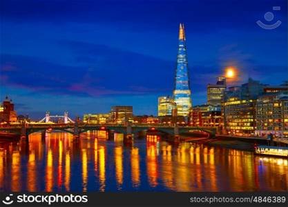 London skyline sunset on Thames river reflection at UK