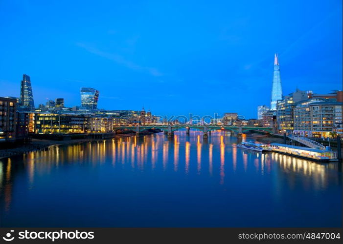 London skyline sunset on Thames river reflection at UK