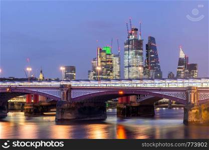 London Skylines building with river thames sunset twilight in London UK.