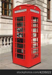 London telephone box. Traditional red telephone box in London UK