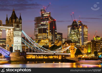 London Tower Bridge with London downtown skylines building in background, London UK.