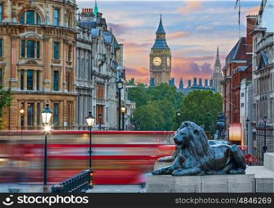 London Trafalgar Square lion and Big Ben tower at background
