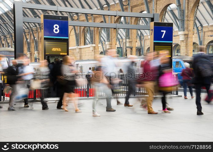 London Train Tube station Blur people movement in rush hour at King&rsquo;s Cross station, England, UK
