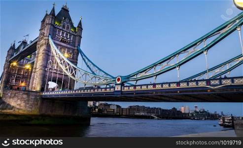 London, UK - Apr 20, 2019 : see the pattern of the famous Tower Bridge in the evening with the blue sky above the River Thames.