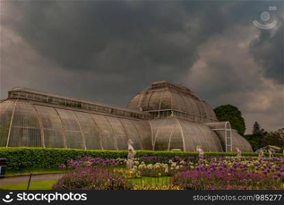 London, UK - Apr 9, 2019 : Side view of greenhouse at Kew Gardens (Royal Botanic Gardens).