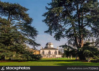 LONDON, UK - MAR 31, 2019 : In the back of Chiswick House on West London, Uk. Chiswick House is a magnificent neo Palladian villa set in beautiful historic gardens.