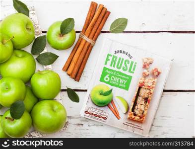 LONDON, UK - SEPTEMBER 15, 2018: Box of Jordans Frusli with apple and cinnamon taste with fresh apples.