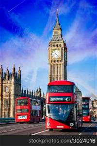LONDON, UNITED KINGDOM - JANUARY 2: The Elizabeth Tower on January 2, 2015 in London. The Clock Tower, named in tribute to Queen Elizabeth II, more popularly known as Big Ben and iconic red buses.