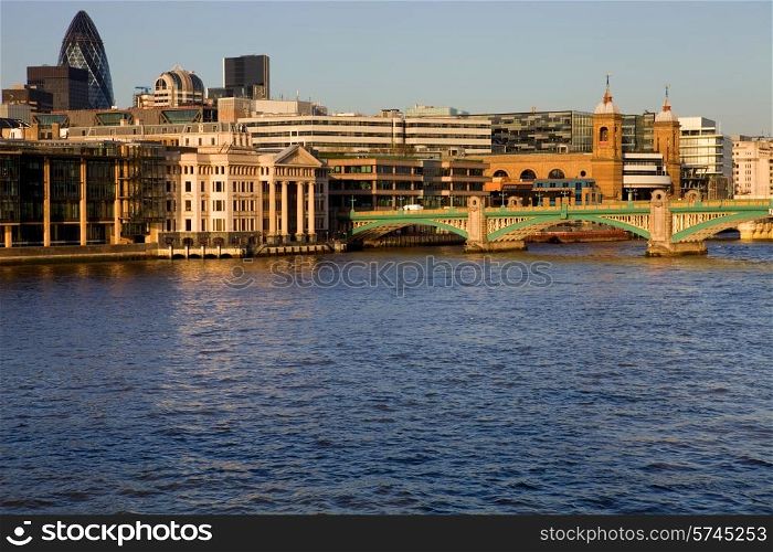 London view, river thames with some old and new buildings