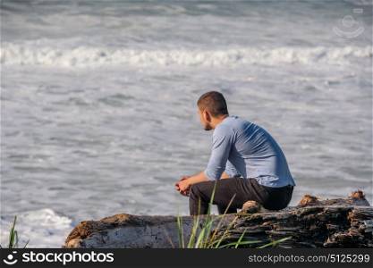 Lone man at beach, autumn. USA Pacific coast landscape, California